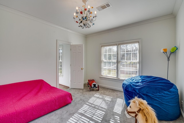 carpeted bedroom with crown molding and a chandelier