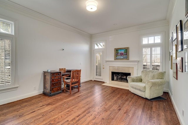 office area featuring hardwood / wood-style flooring, crown molding, and a high end fireplace