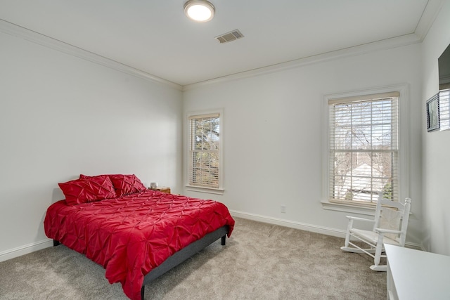 bedroom featuring ornamental molding and carpet