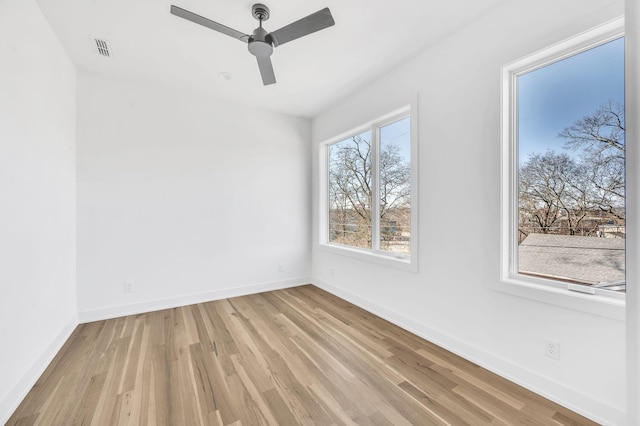 empty room with light hardwood / wood-style floors and ceiling fan