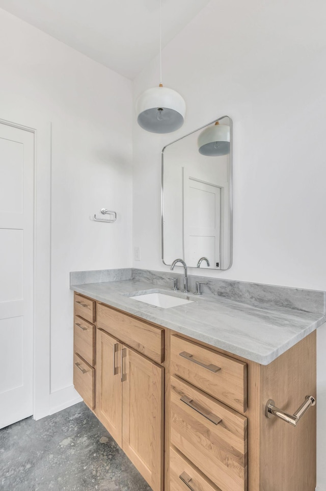 bathroom featuring vanity and concrete flooring