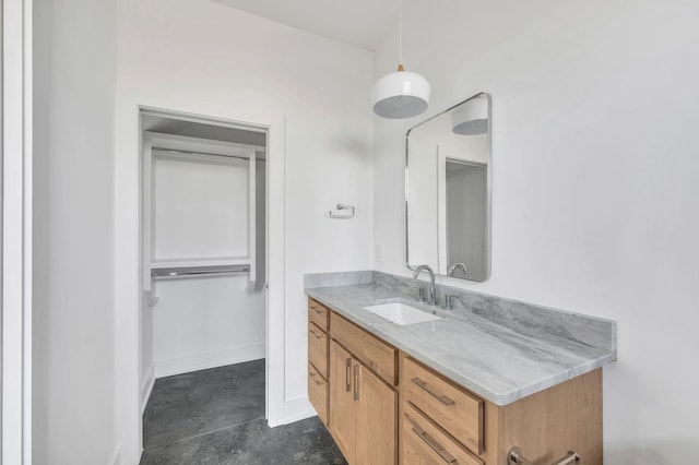 bathroom featuring vanity and concrete flooring