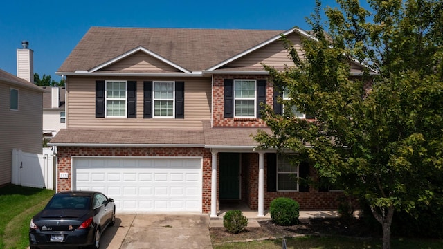 view of front of property with a garage