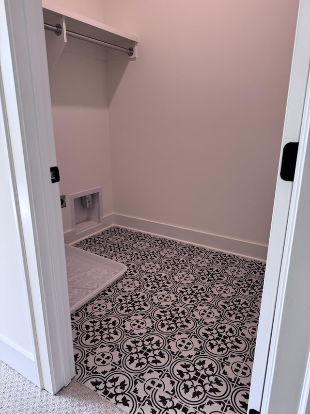 laundry room featuring hookup for a washing machine, electric dryer hookup, and light tile patterned floors