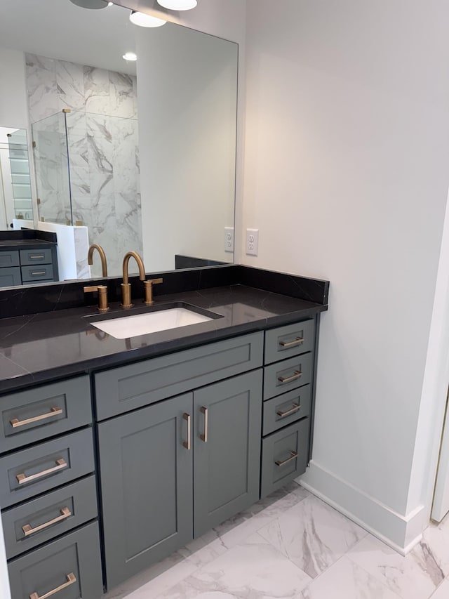 bathroom featuring walk in shower and vanity