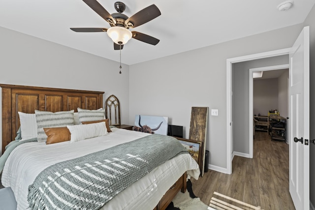 bedroom featuring hardwood / wood-style flooring and ceiling fan