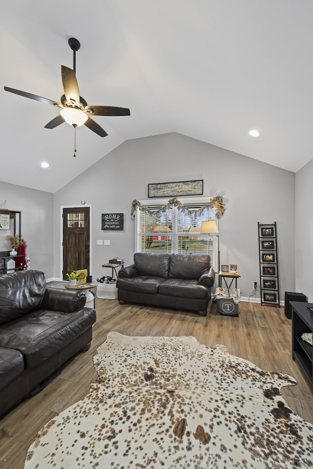 living room featuring vaulted ceiling, hardwood / wood-style floors, and ceiling fan