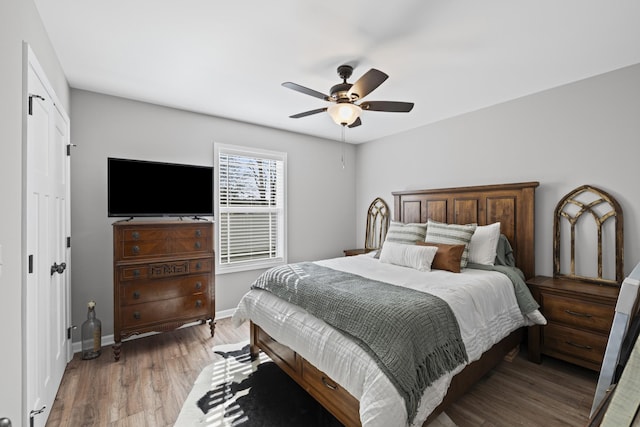 bedroom with wood-type flooring and ceiling fan