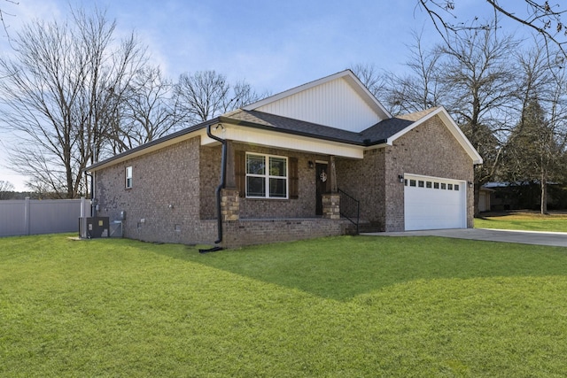 view of front of home with a garage, central AC, and a front lawn