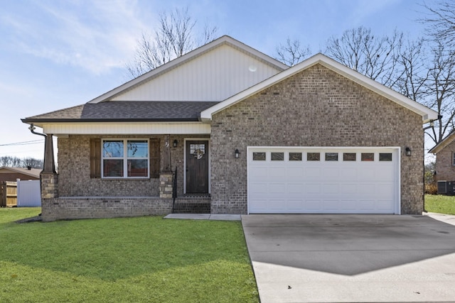 view of front of home with a garage and a front yard