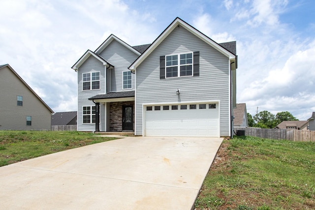 front facade with a garage and a front lawn