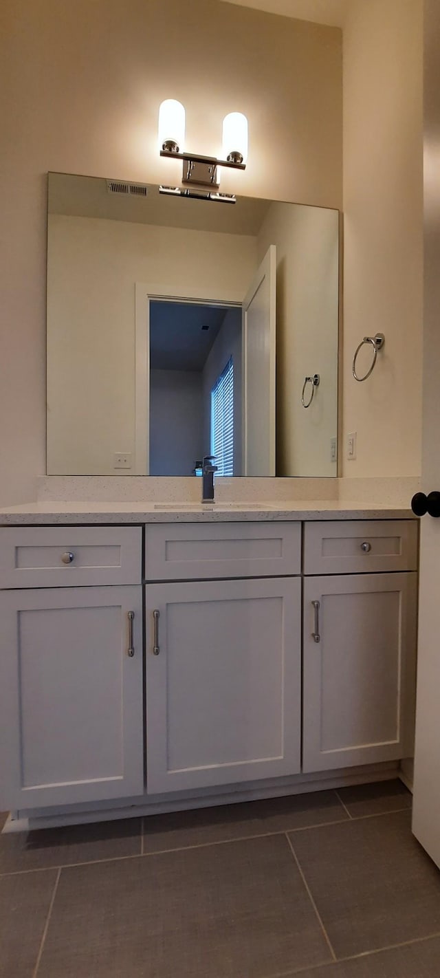 bathroom featuring vanity and tile patterned flooring