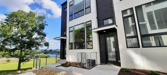 doorway to property with a water view