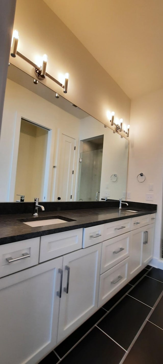 bathroom featuring vanity and tile patterned flooring