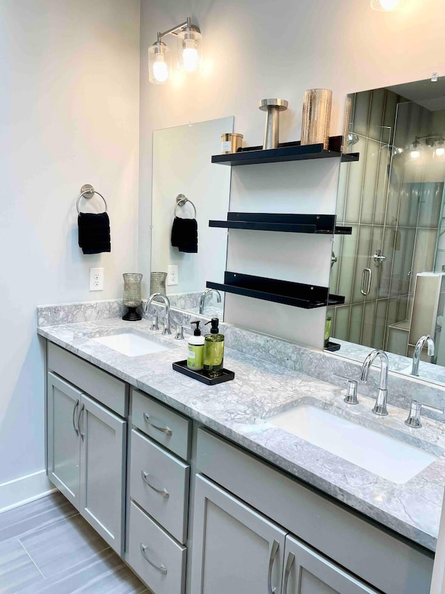 bathroom featuring an enclosed shower and vanity