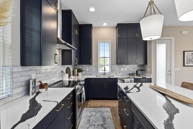 kitchen featuring pendant lighting, sink, backsplash, dark hardwood / wood-style flooring, and stainless steel range with electric stovetop