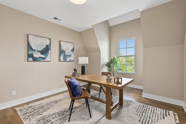 home office with dark wood-type flooring