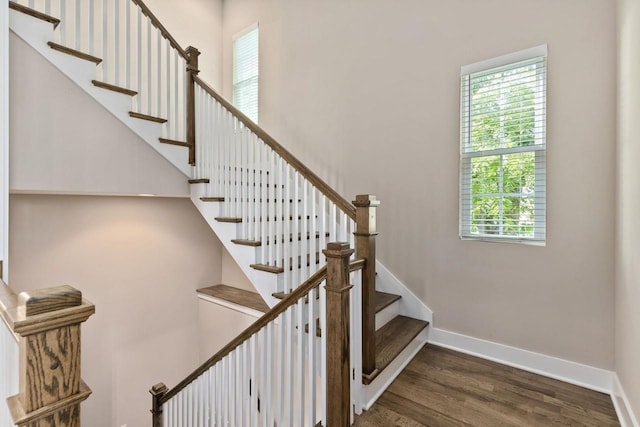 stairs featuring wood-type flooring