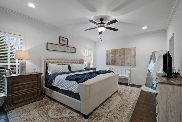 bedroom with crown molding, dark hardwood / wood-style floors, and ceiling fan