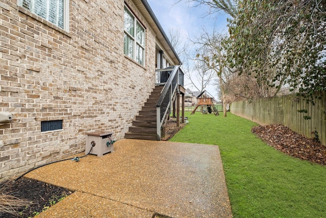 view of yard with a playground and a patio area