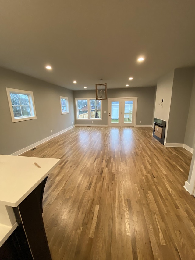 unfurnished living room featuring light hardwood / wood-style floors