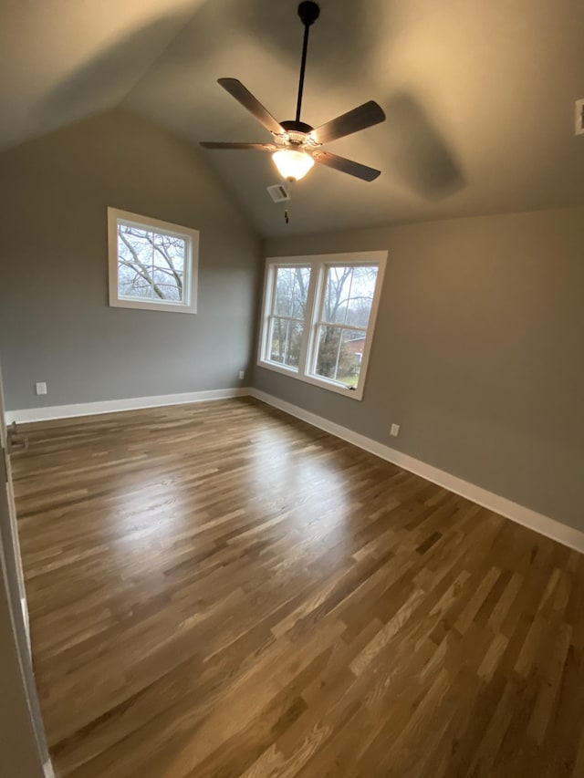 bonus room featuring ceiling fan, dark hardwood / wood-style flooring, and vaulted ceiling