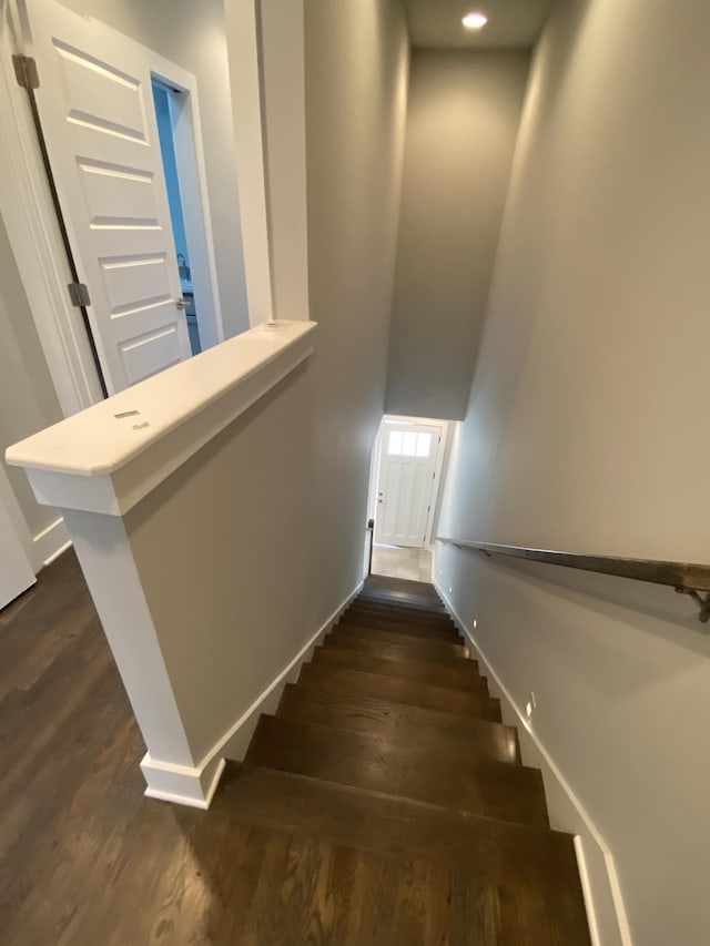 stairs with wood-type flooring