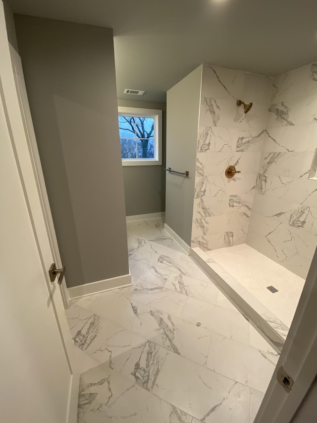 bathroom featuring tiled shower