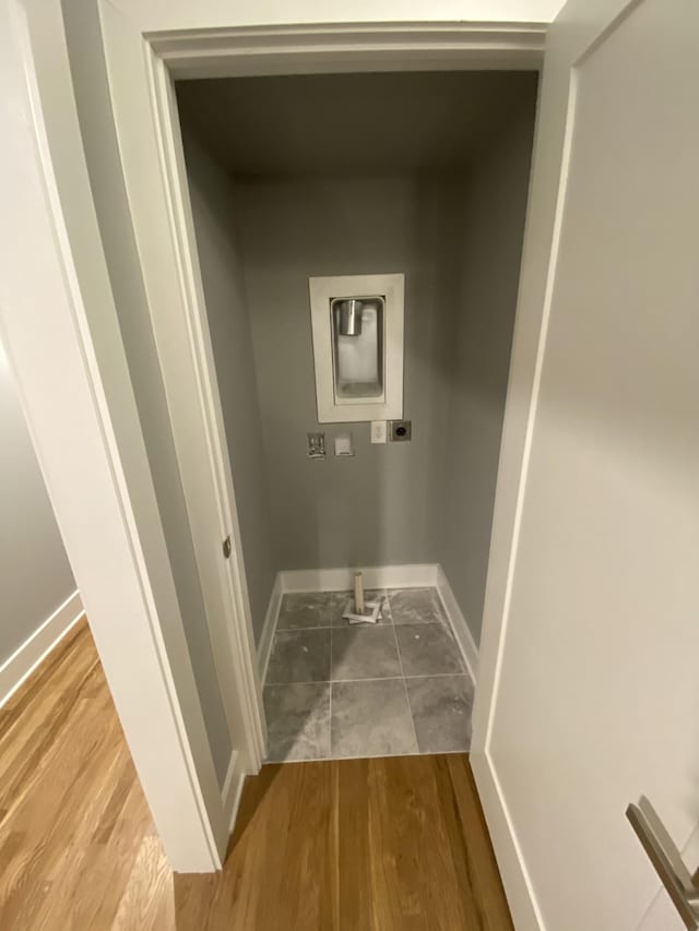 laundry area featuring hardwood / wood-style flooring and electric dryer hookup