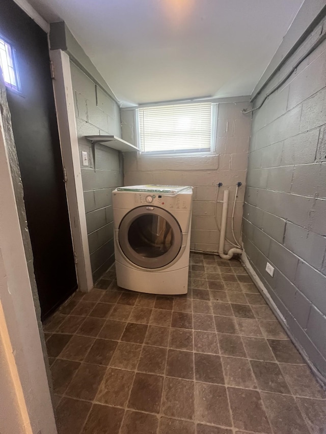 washroom with plenty of natural light and washer / dryer