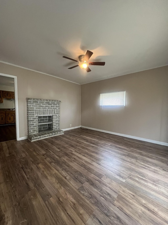 unfurnished living room featuring wood-type flooring, crown molding, and ceiling fan