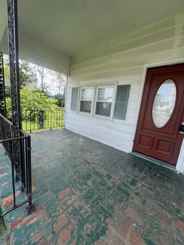 doorway to property featuring a porch