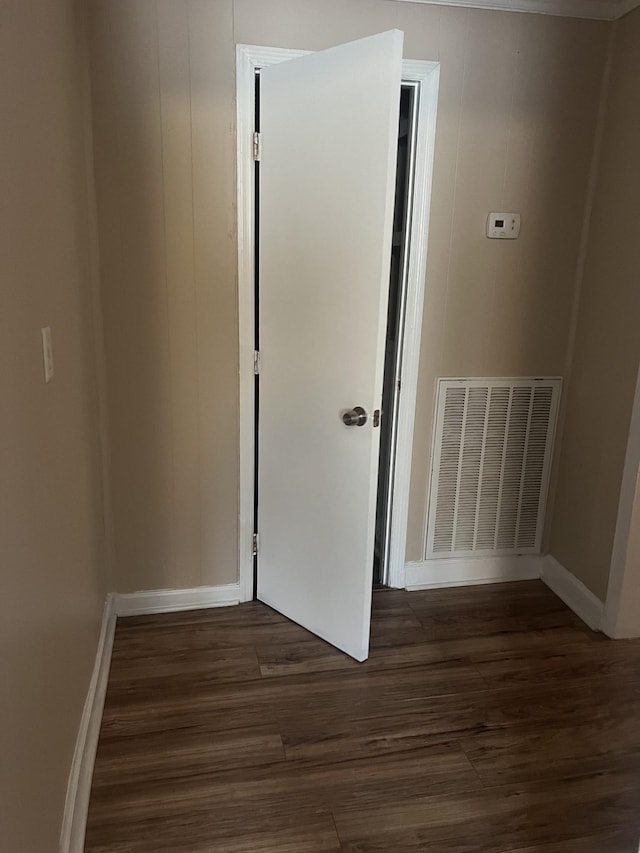 unfurnished room with dark hardwood / wood-style floors