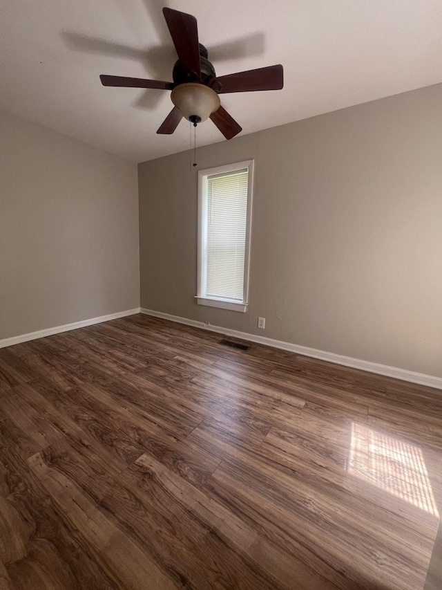 unfurnished room featuring dark wood-type flooring