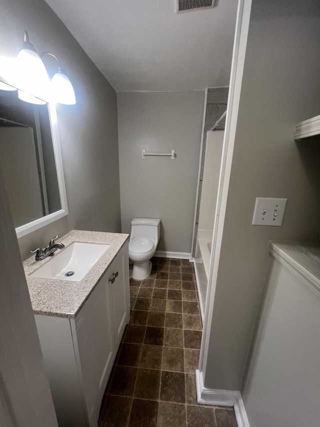 bathroom with vanity and toilet