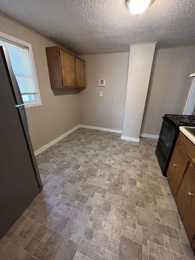 laundry room featuring a textured ceiling