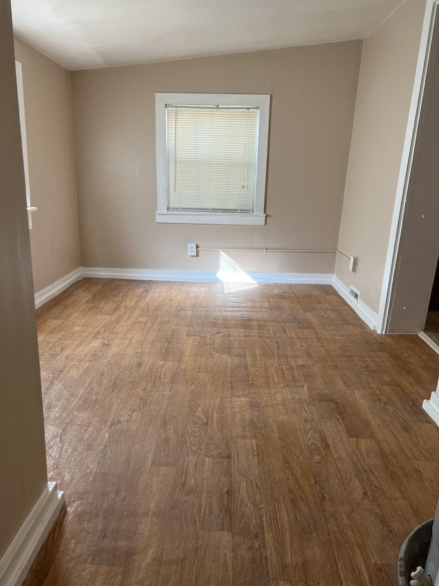 empty room featuring hardwood / wood-style flooring