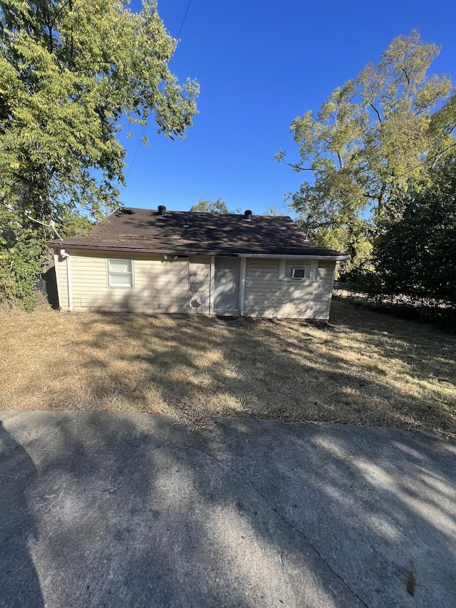 view of home's exterior with a yard