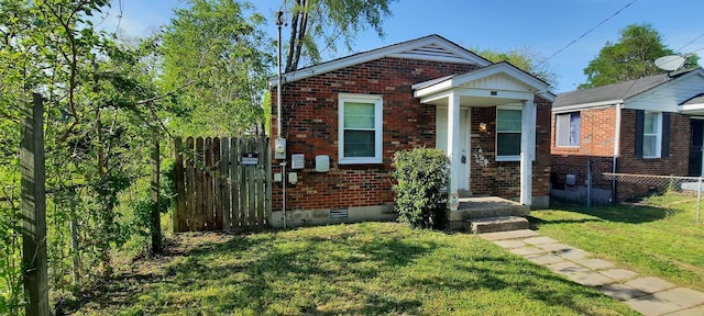 bungalow-style house with a front yard