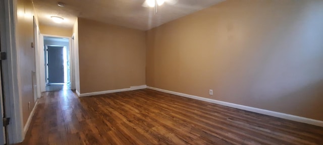 unfurnished room featuring dark hardwood / wood-style floors