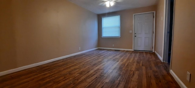 unfurnished room featuring dark hardwood / wood-style floors and ceiling fan