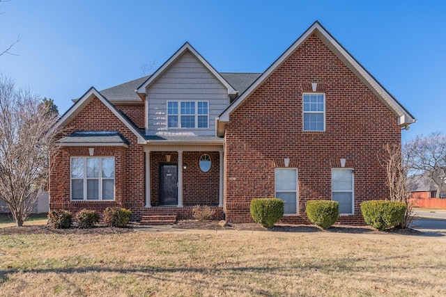 front facade featuring a front lawn