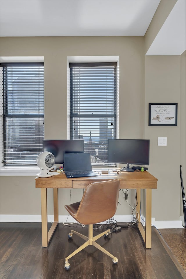 office area with baseboards and wood finished floors