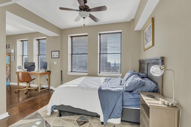 bedroom with baseboards and a ceiling fan