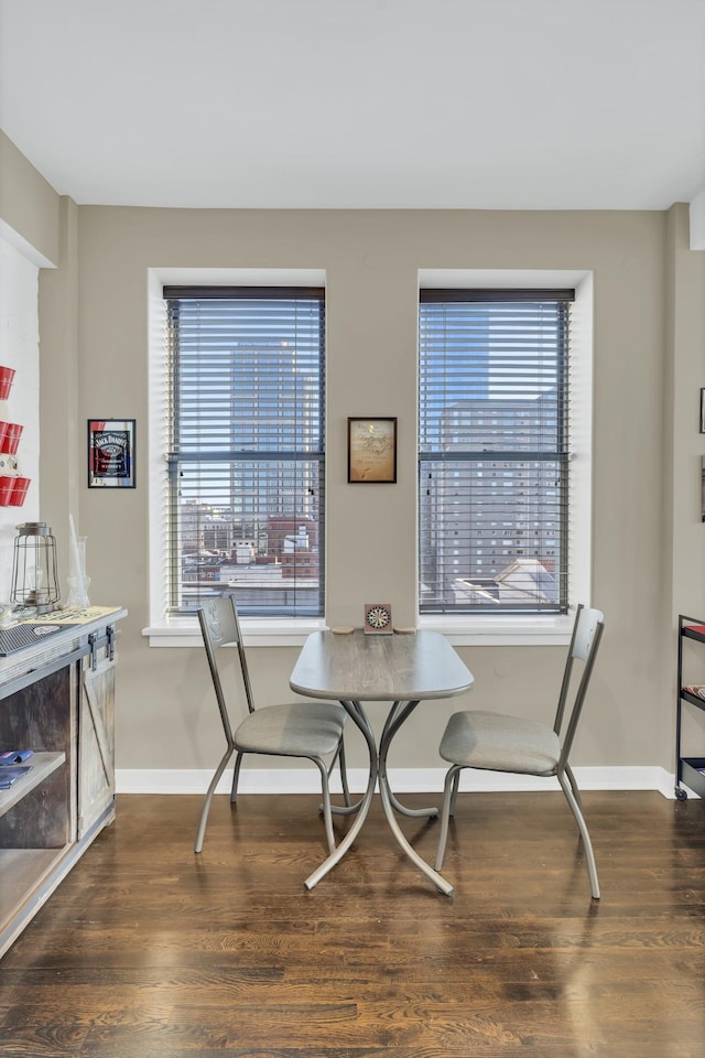 dining room featuring dark hardwood / wood-style flooring and breakfast area