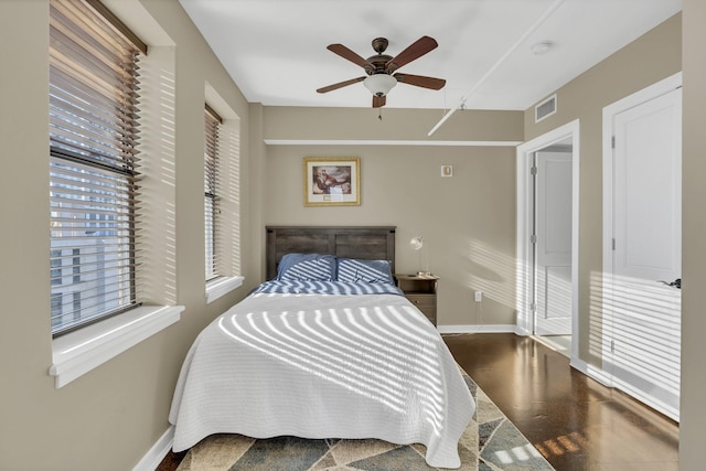 bedroom featuring visible vents, ceiling fan, and baseboards