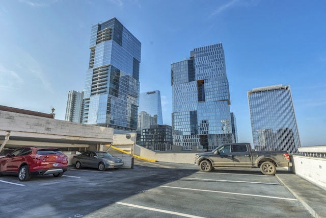 partially covered parking lot with a view of city