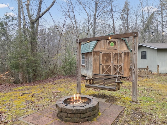 view of outdoor structure featuring an outdoor fire pit