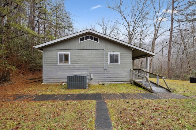 view of side of home with cooling unit