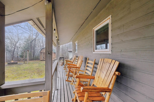 wooden terrace featuring a porch